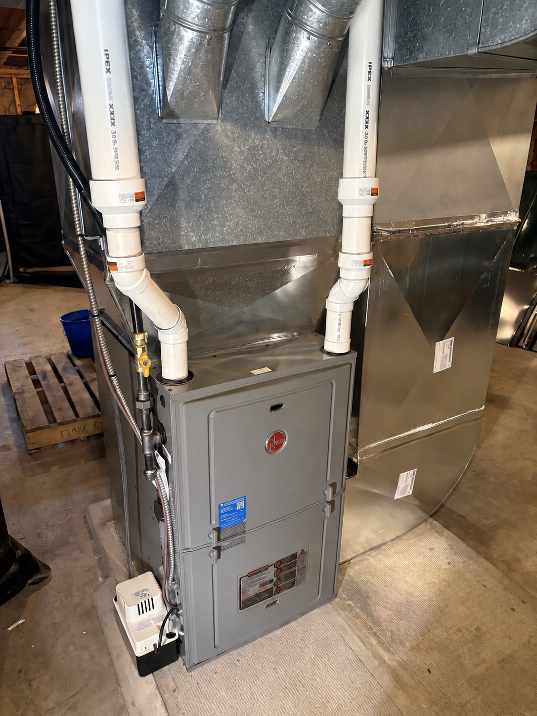 Rheem propane furnace with ductwork and vent pipes